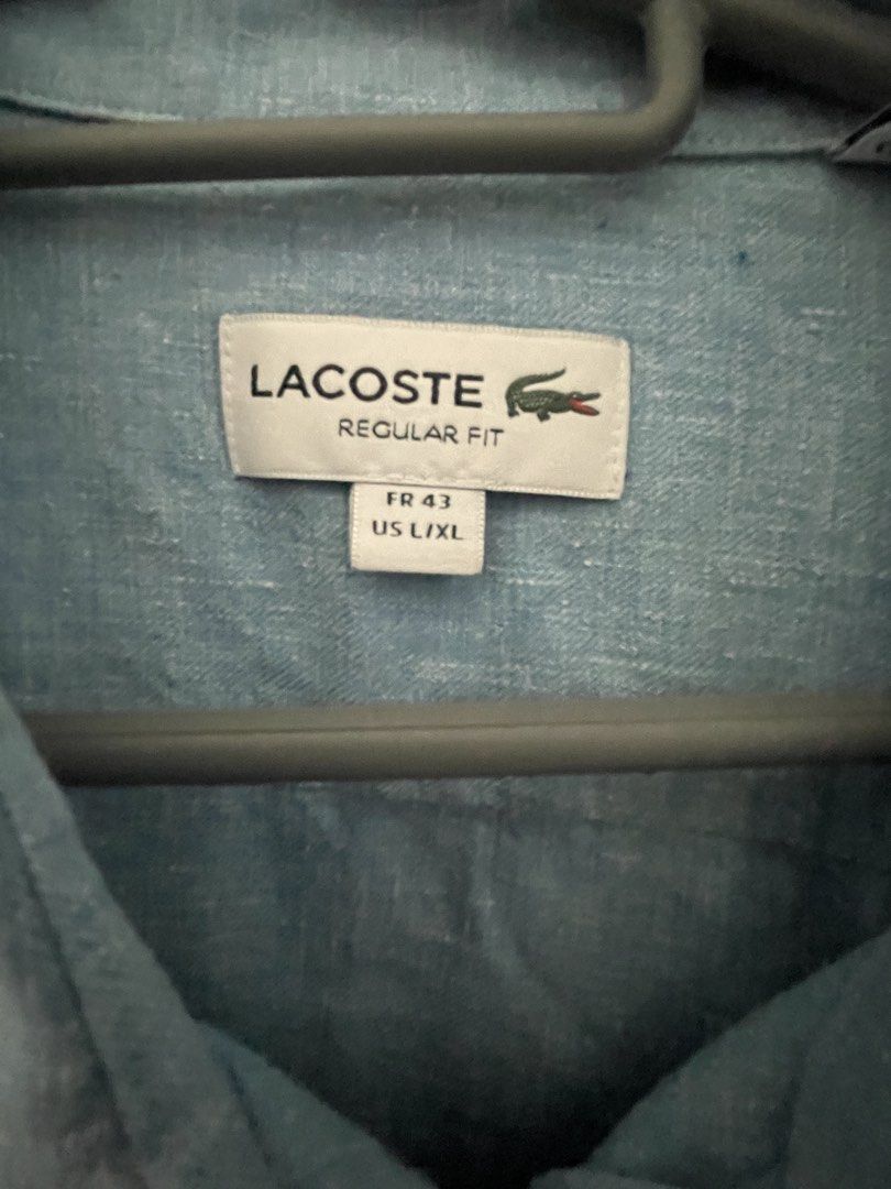 Lacoste Regular Fit Long Sleeve Shirt (Category: Tshirts & Polo Shirts ) located in Manila. Submitted by baymaxthegreat (Listing ID 1437418146, Image 2). Description: - Lacoste long sleeve shirt - Light blue color - Regular fit - Size: FR 43 / US L/XL - Iconic Lacoste logo on chest - Button-down closure - Classic collar - Lightweight fabric - Perfect for casual wear.