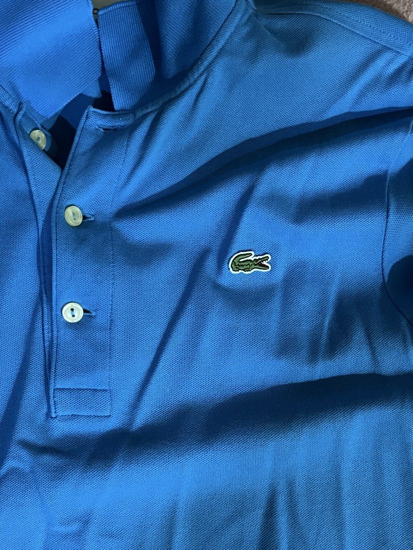 Lacoste Slim Fit Polo Shirt (Category: Tshirts & Polo Shirts ) located in Manila. Submitted by boldtree_947e32 (Listing ID 1437580868, Image 1). Description: - Authentic Lacoste polo shirt - Vibrant blue color - Slim fit design - Size: FR 3 / US 5 - Iconic Lacoste crocodile logo - Made with quality materials - Suitable for casual and semi-formal wear.