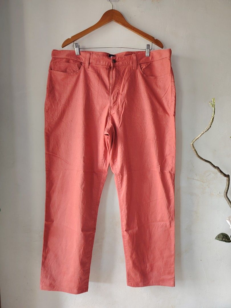 Lands' End Traditional Fit Pants (Category: Jeans) located in Magdalena. Submitted by magdalenathrift20 (Listing ID 1437417094, Image 2). Description: - Lands' End pants - Vibrant coral color - Size: 42/T - Traditional fit - Multiple pockets - Durable fabric - Classic and versatile design.