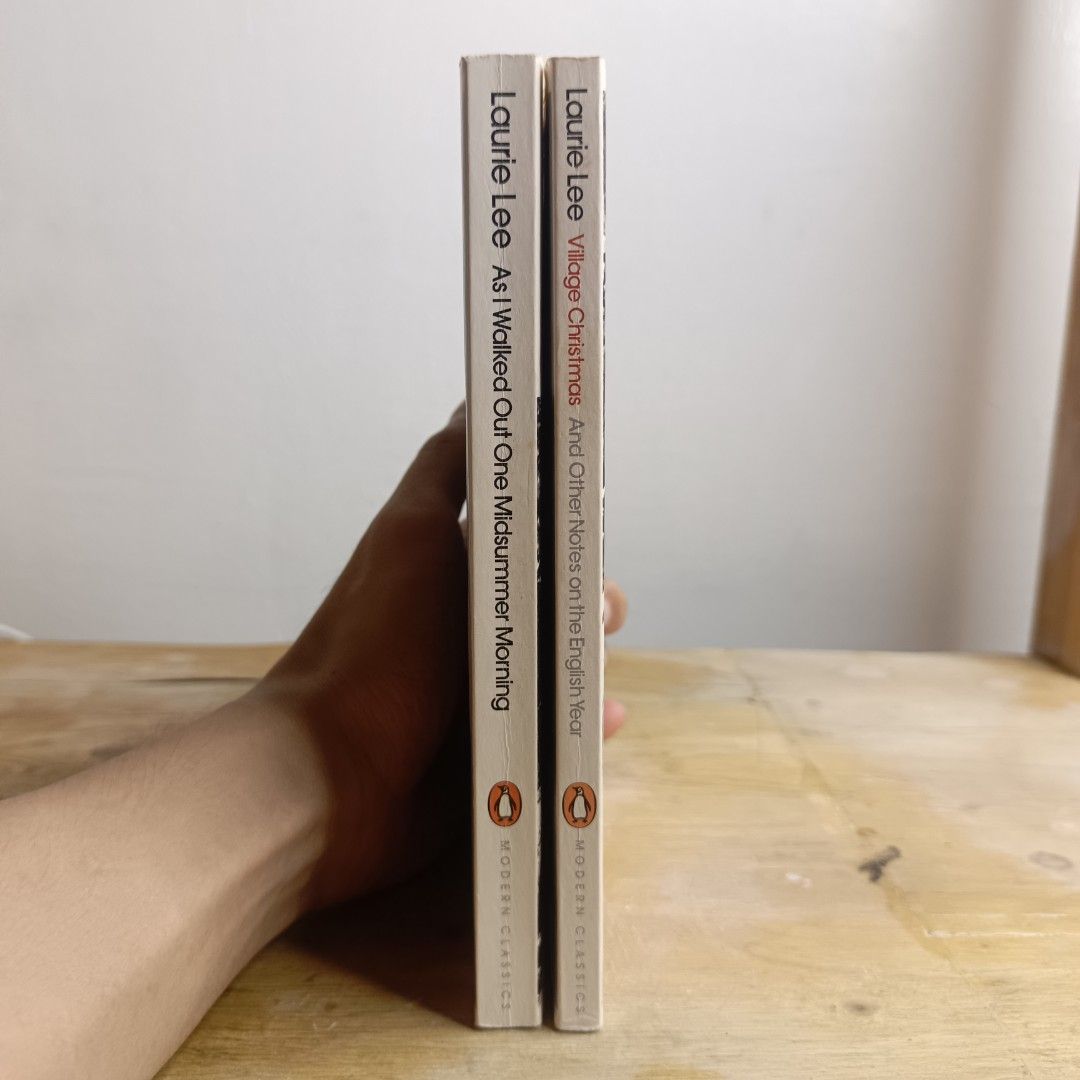 Laurie Lee Penguin Modern Classics Books (Category: Storybooks) located in Manila. Submitted by shelfenjoyment (Listing ID 1437517486, Image 3). Description: 349 each. Take both for 500. Two Penguin Modern Classics books by Laurie Lee. Titles include "As I Walked Out One Midsummer Morning" and "Village Christmas and Other Notes on the English Year". Both books have visible wear on the edges. The books are in English..
