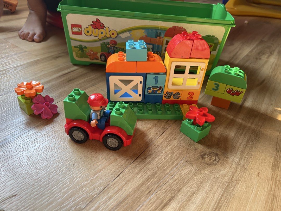 LEGO Duplo Farm Set (Category: Lego & Building Sets) located in Quezon. Submitted by smallville.ph (Listing ID 1437472489, Image 1). Description: - LEGO Duplo Farm Set - Includes farm building, tractor, farmer figure, and building blocks. - Comes with a green storage box. - Ideal for toddlers and young children. - Develops creativity and fine motor skills..