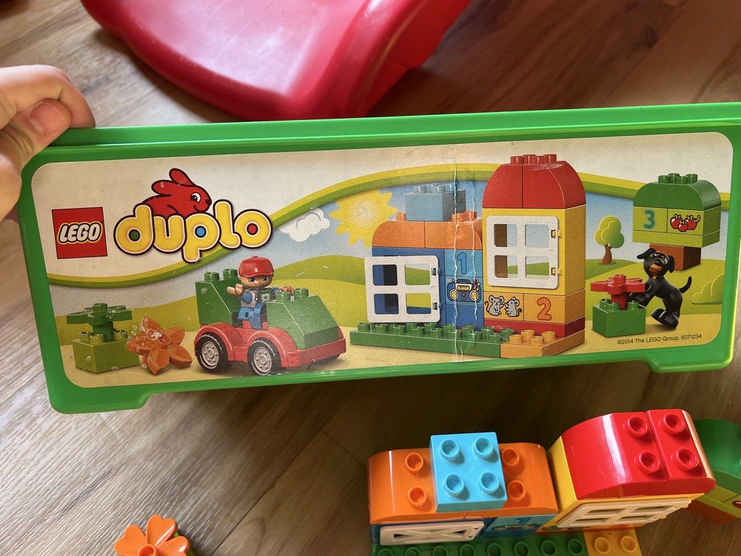 LEGO Duplo Farm Set (Category: Lego & Building Sets) located in Quezon. Submitted by smallville.ph (Listing ID 1437472489, Image 2). Description: - LEGO Duplo Farm Set - Includes farm building, tractor, farmer figure, and building blocks. - Comes with a green storage box. - Ideal for toddlers and young children. - Develops creativity and fine motor skills..