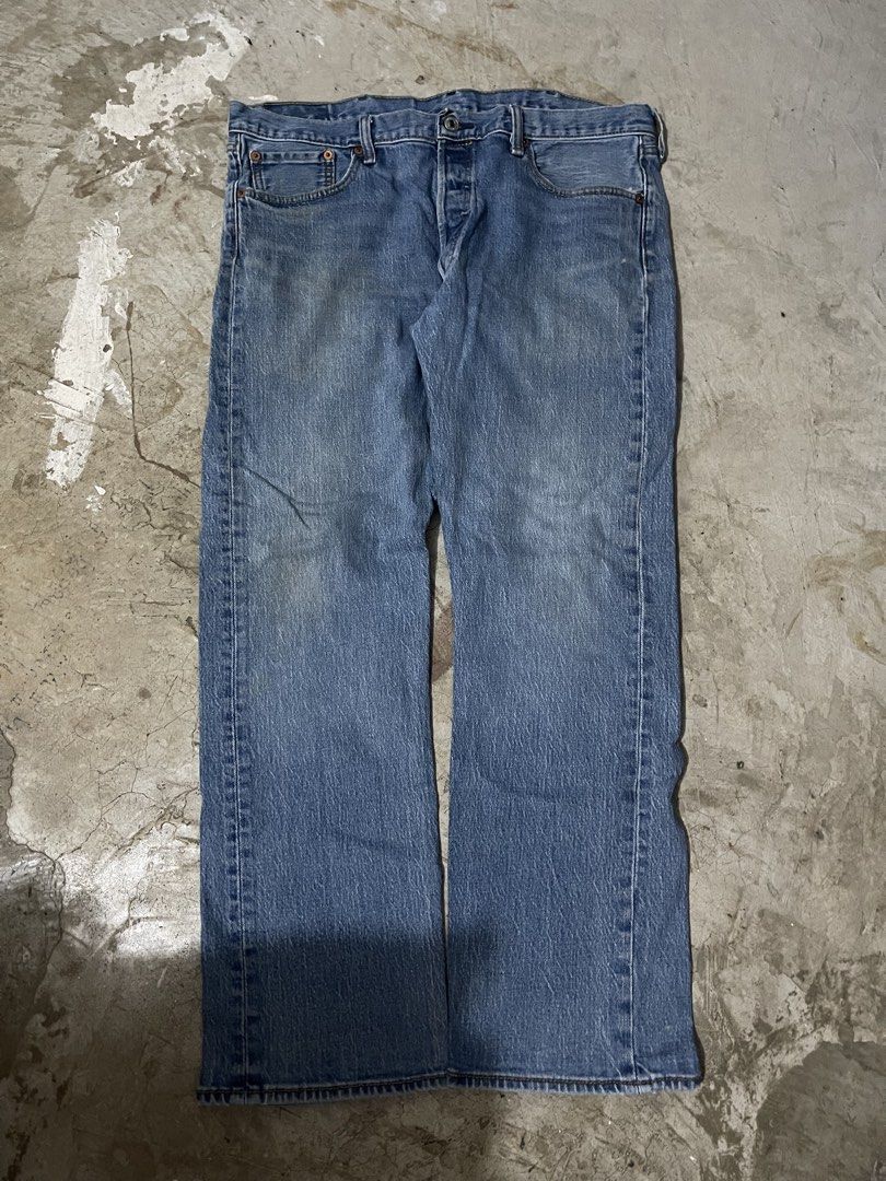 Levi's 501 Button Fly Jeans (Category: Jeans) located in Manila. Submitted by jiahhncarl57791 (Listing ID 1437491284, Image 2). Description: Classic Levi's 501 jeans with a button fly. Features the iconic Levi's red tab on the back pocket. The jeans have a light blue wash and a straight leg fit. Includes the classic five-pocket design. The tag indicates the jeans were made in Egypt..