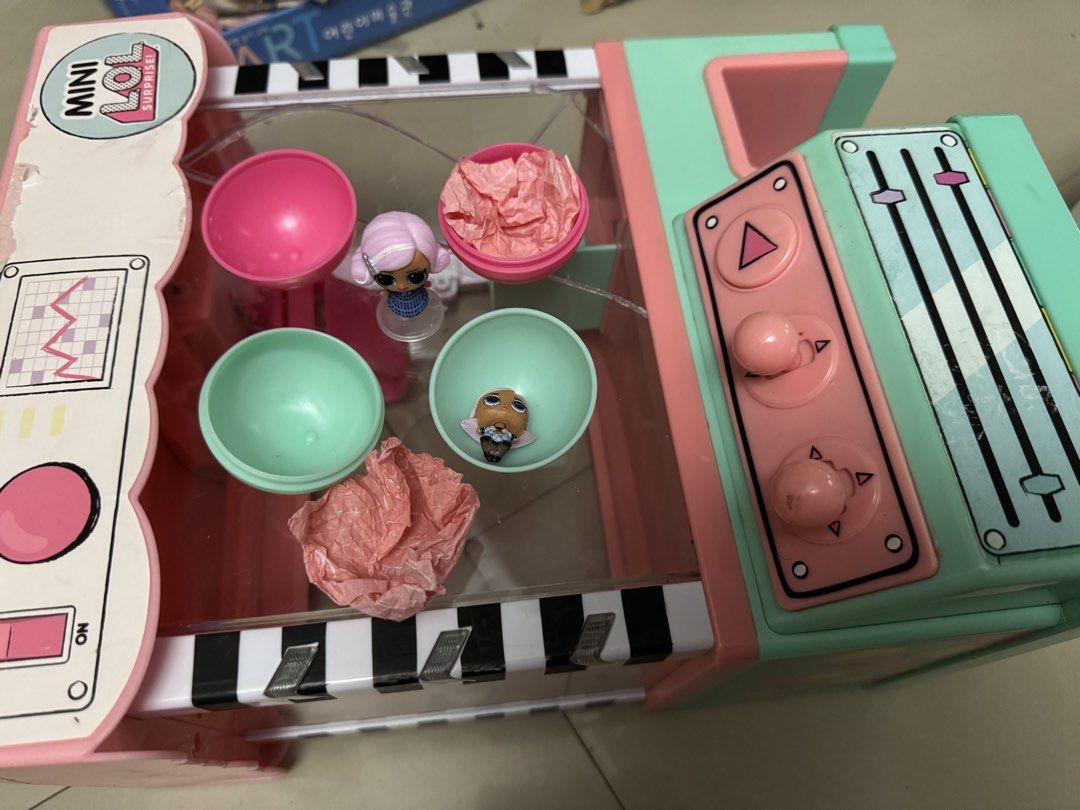 LOL Surprise! Mini Claw Machine Playset (Category: Toys & Games) located in Mandaluyong City. Submitted by elainelawenko (Listing ID 1437566790, Image 3). Description: - LOL Surprise! Mini Claw Machine - Tested and working - Acrylic is broken but can be glued - Includes free plushies and LOL Surprise! dolls - Requires 4 AA batteries - Colors: Pink and Mint Green.