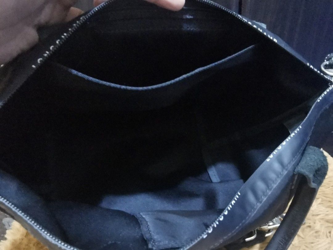 Longchamp Energy Handbag (Category: Luxury Bags & Wallets) located in Aringay. Submitted by ycels_purselove (Listing ID 1437484591, Image 3). Description: Brand: Longchamp Energy Handbag w/sling Condition: Like new Color: Black Size: small-medium Length = approximately 15in (upper body) / 9in (lower body) Width = 6in Height = 9in *** w/ YKK markings on zipper and stamped "longchamp modele depose" at the back of its leather cover.