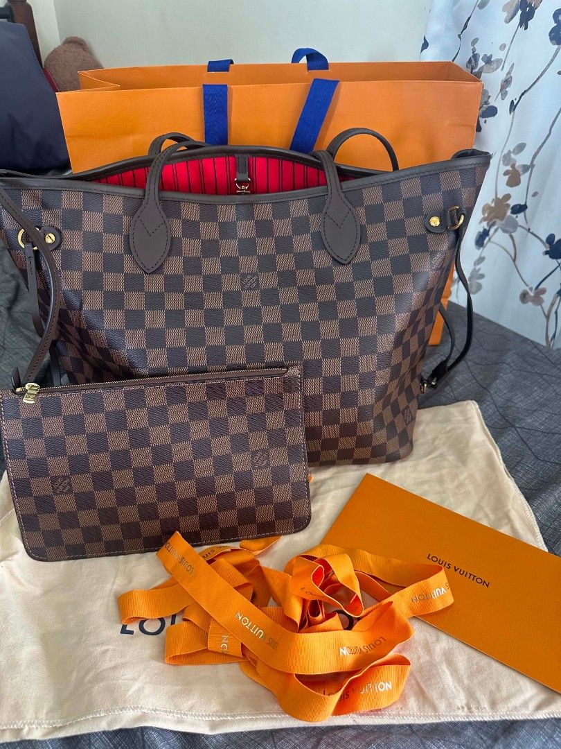 Louis Vuitton Damier Ebene Neverfull MM (Category: Luxury Bags & Wallets) located in Manila. Submitted by keengem-8c19 (Listing ID 1437530059, Image 1). Description: - Authentic Louis Vuitton Neverfull MM handbag - Damier Ebene canvas - Includes matching pouch, dust bag, shopping bag, and receipt - Brown leather handles and trim - Red interior lining - Classic tote design - Spacious interior - Comes with original tags and packaging.