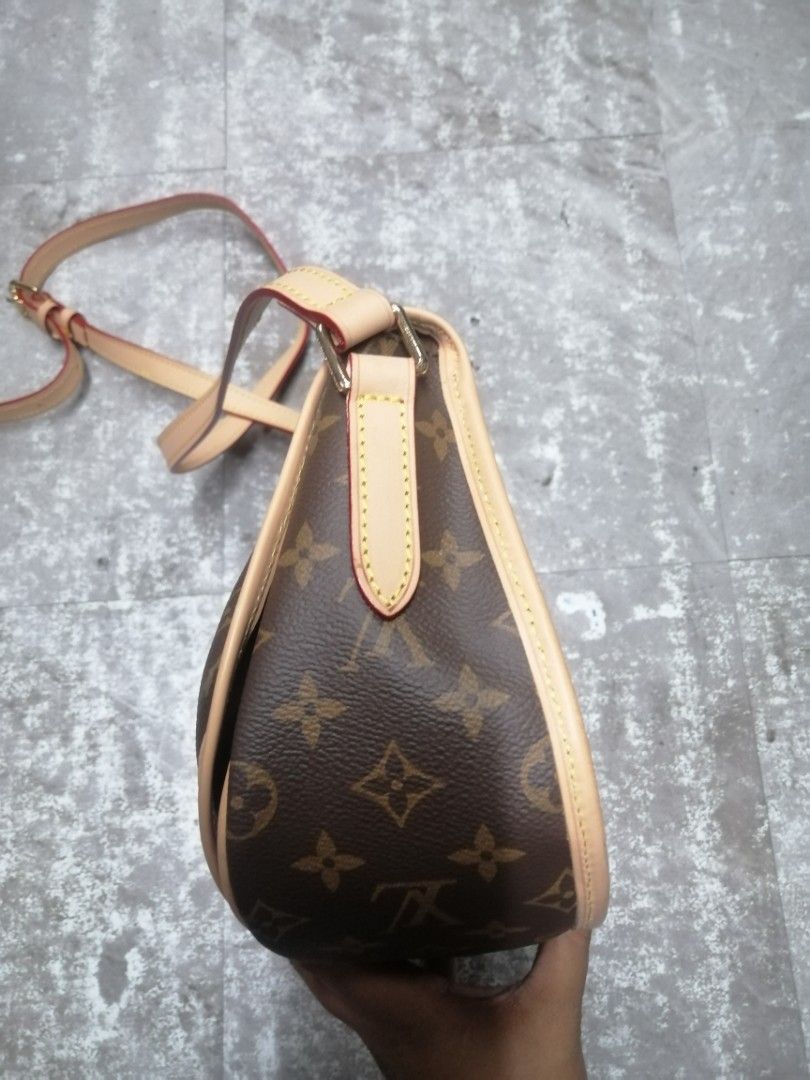 Louis Vuitton Menilmontant Pm Bag (Category: Luxury Bags & Wallets) located in Baguio. Submitted by brandeditems16 (Listing ID 1437576298, Image 3). Description: - Authentic Louis Vuitton shoulder bag - Classic Monogram canvas - Tan leather strap and trim - Curved shape with flap closure - Ideal for everyday or special occasions.