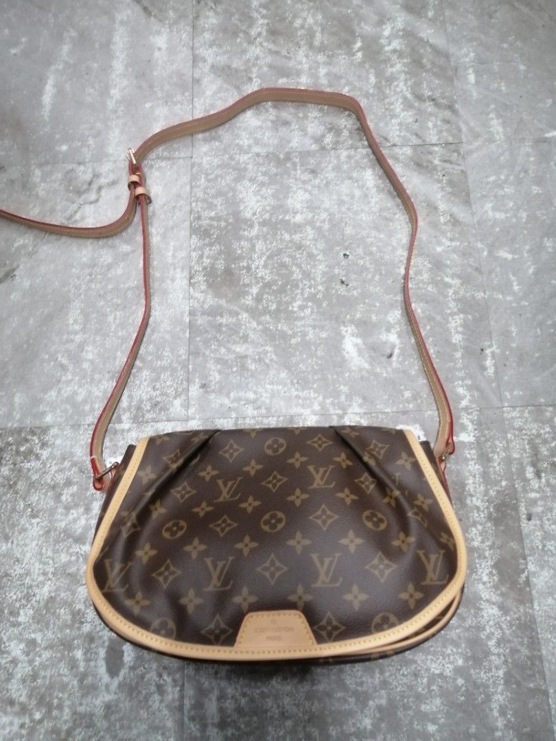 Louis Vuitton Menilmontant Pm Bag (Category: Luxury Bags & Wallets) located in Baguio. Submitted by brandeditems16 (Listing ID 1437576298, Image 1). Description: - Authentic Louis Vuitton shoulder bag - Classic Monogram canvas - Tan leather strap and trim - Curved shape with flap closure - Ideal for everyday or special occasions.