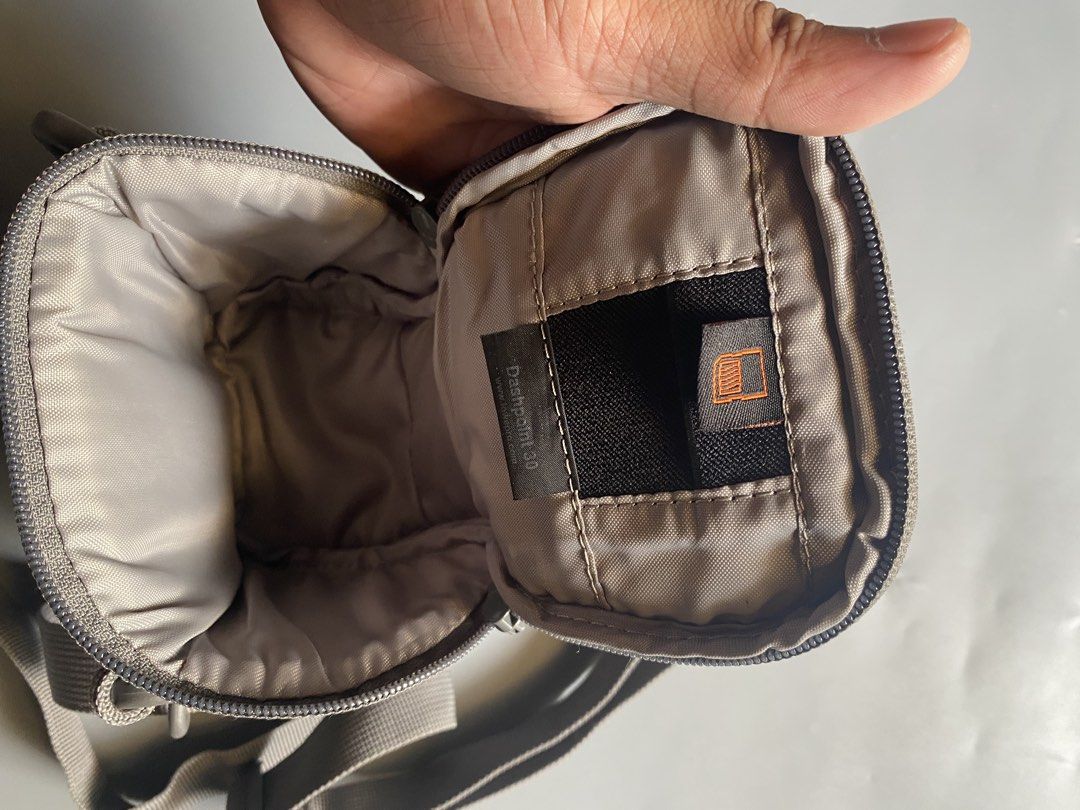 Lowepro Dashpoint 30 Camera Bag (Category: Camera Bags & Carriers) located in Manila. Submitted by thriftwhoop (Listing ID 1437513797, Image 2). Description: - Lowepro Dashpoint 30 camera bag. - Protects your camera and accessories. - Features a shoulder strap for easy carrying. - Includes a main compartment and a small pocket. - Padded interior for equipment safety. - Stylish gray color..