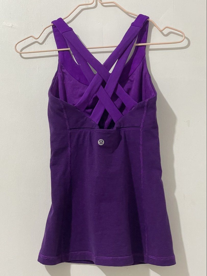 Lululemon Purple CrisscrossTank Top (Category: Activewear) located in Tuguegarao City. Submitted by ziggerryy (Listing ID 1437562659, Image 1). Description: Dot 2 No holes. Minimal flaw on the build in bra(check photos) .