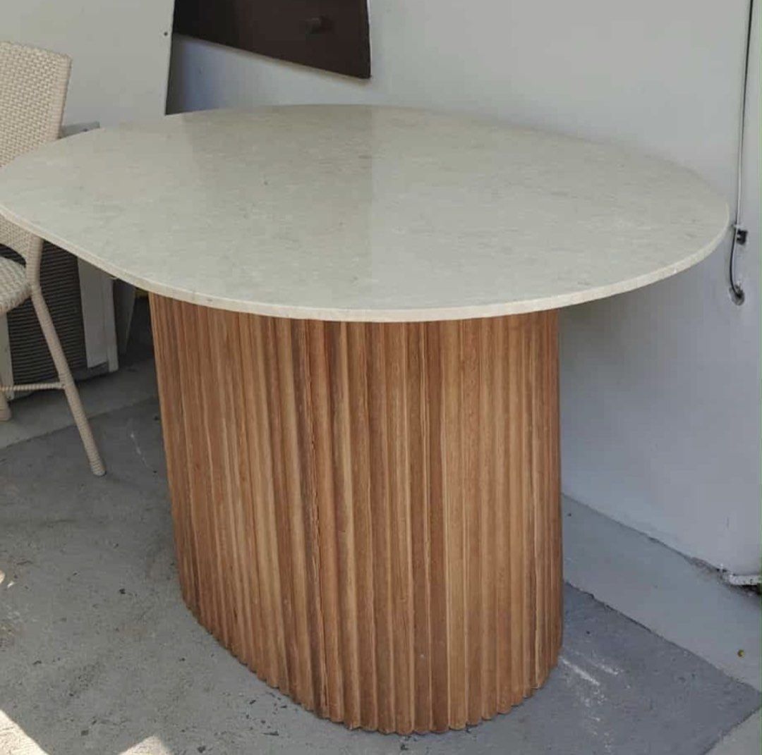 Marble Oval Dining Table with Wooden Base (Category: Tables & Sets) located in Makati City. Submitted by angeldei (Listing ID 1437538234, Image 1). Description: Custom made marble table 118cmx94cm Height: 70cm Selling for ₱30,000. Bought this for ₱45,000. Pick up in Alabang..
