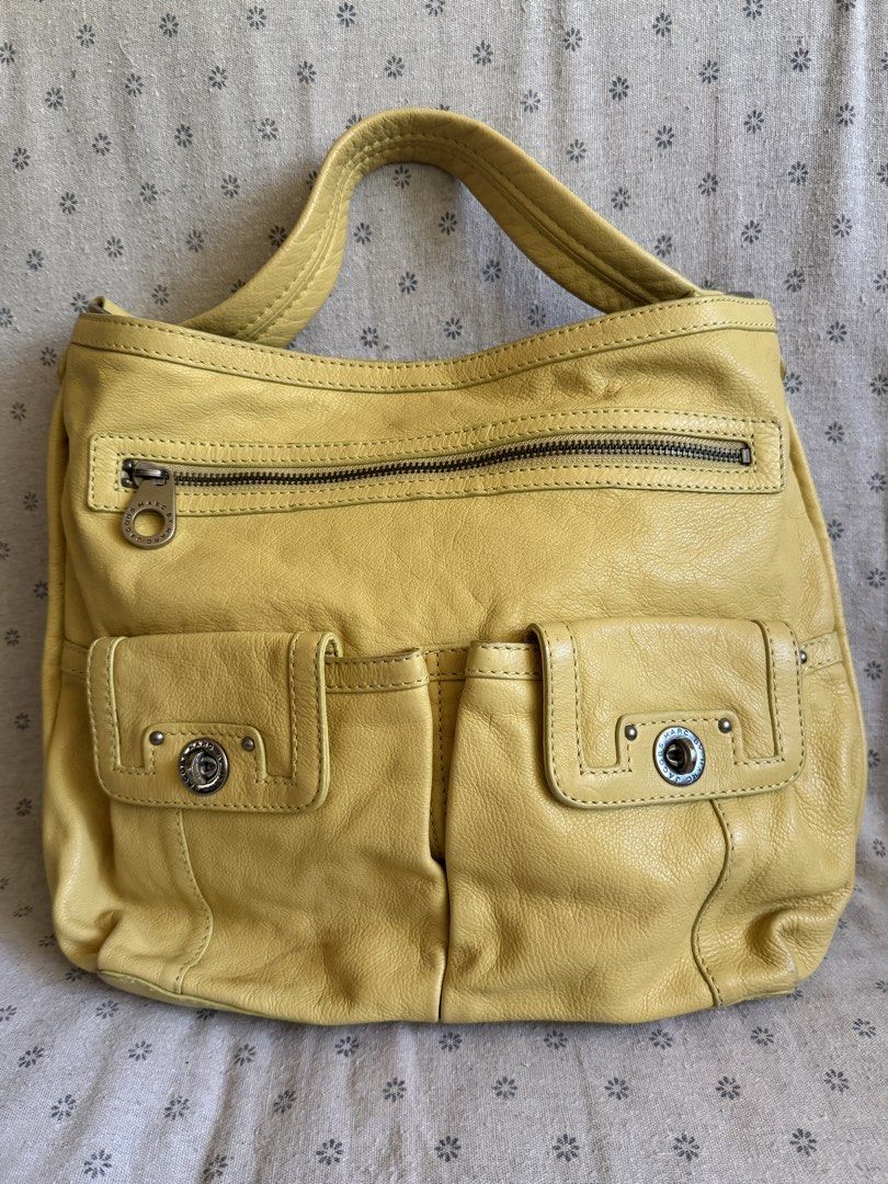 SALE Marc Jacobs Hobo Bag (Category: Luxury Bags & Wallets) located in Manila. Submitted by claraandluna (Listing ID 1437567847, Image 1). Description: Preloved authentic Marc Jacobs Hobo Bag In beautiful yellow color Well used, no major flaws Signs of use on leather only Silver hardwares .