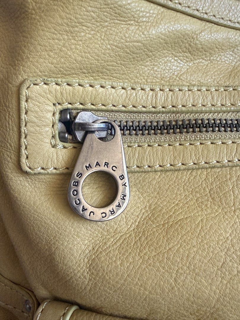 SALE Marc Jacobs Hobo Bag (Category: Luxury Bags & Wallets) located in Manila. Submitted by claraandluna (Listing ID 1437567847, Image 3). Description: Preloved authentic Marc Jacobs Hobo Bag In beautiful yellow color Well used, no major flaws Signs of use on leather only Silver hardwares .
