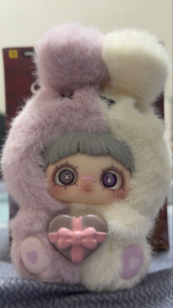 May I Love You Plush Doll Blind Box (Category: Plushies & Soft Toys) located in Manila. Submitted by jonelllliiii (Listing ID 1437456264, Image 2). Description: - May I Love You Plush Doll Blind Box - Brand: Sure Fun - Features a doll in a red devil-like outfit - Includes a heart-shaped lock and gift - Doll has big eyes - Outfit: Pink and white fur - Age Recommendation: 15+.