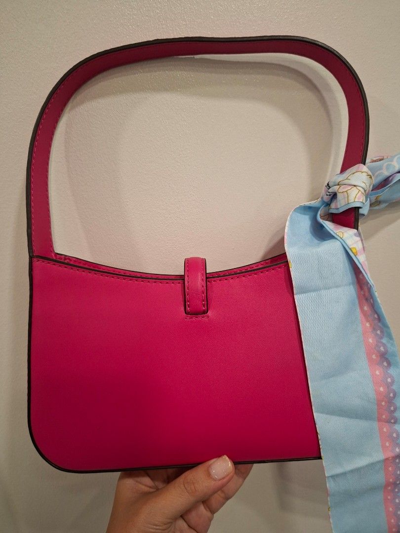 Michael Kors Pink Handbag (Category: Luxury Bags & Wallets) located in Mandaluyong City. Submitted by k__z__ (Listing ID 1437530401, Image 3). Description: - Authentic Michael Kors handbag - Eye-catching vibrant pink color - Stylish top handle - Elegant silver-tone clasp with Michael Kors logo, no hairline scratches, magnetoc clasp - Secure zipper closure - Interior lined with light-colored fabric RFS: bought for my daughter for 9k but she prefer
