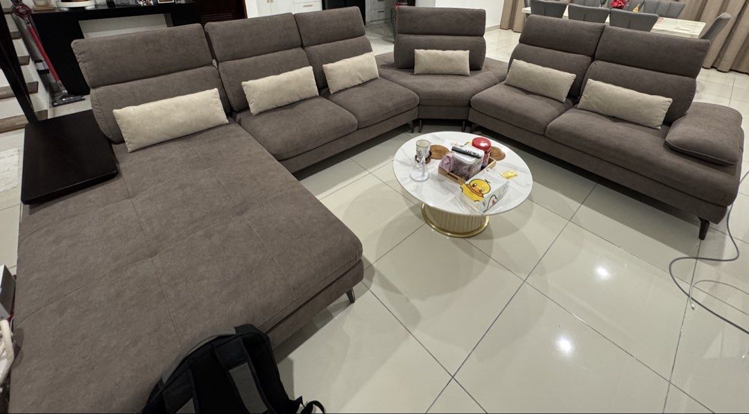 Modular Sofa with Side Table (Category: Sofas) located in Petaling Jaya. Submitted by vl_preloved (Listing ID 1437528696, Image 1). Description: - Modular sofa in neutral grey-brown - Customizable sections to fit your space - Includes built-in side table - Comes with matching throw pillows - Modern design - Comfortable, cushioned seating and backrests ❗️Self pick up at Tropicana Heights, Kajang. .