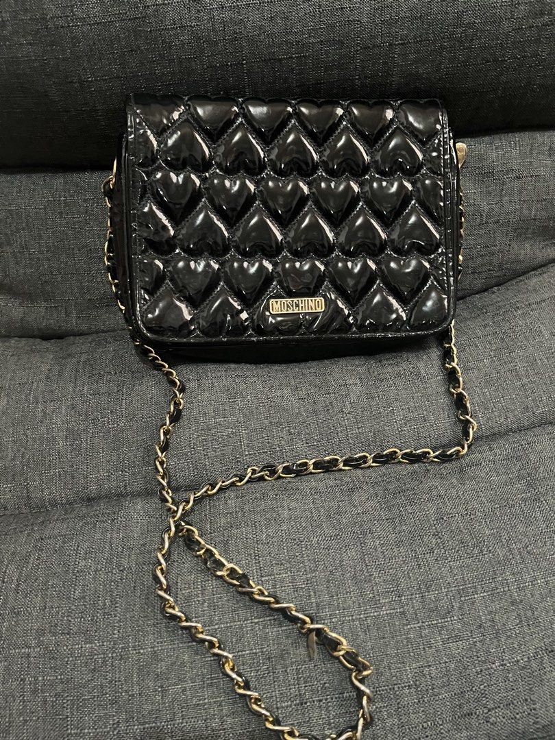 Moschino Heart Quilted Shoulder Bag (Category: Luxury Bags & Wallets) located in Manila. Submitted by rabbitswardrobe (Listing ID 1437581078, Image 1). Description: ♥️Moschino Quilted Bag ♥️5/10 used since this is one of my fave bag ♥️Size One ♥️Bought in Japan ♥️Rfs declutter, with obvious signs of usage, damaged strap but can cover with twilly ♥️All items 100% original 📌MOP GCASH or BDO only 📌SF Shouldered by the buyer 📌Grab/Lalamove 📌Flash
