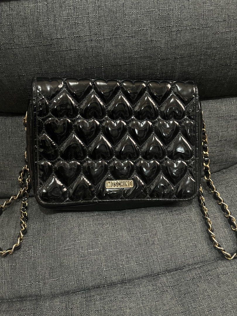 Moschino Heart Quilted Shoulder Bag (Category: Luxury Bags & Wallets) located in Manila. Submitted by rabbitswardrobe (Listing ID 1437581078, Image 2). Description: ♥️Moschino Quilted Bag ♥️5/10 used since this is one of my fave bag ♥️Size One ♥️Bought in Japan ♥️Rfs declutter, with obvious signs of usage, damaged strap but can cover with twilly ♥️All items 100% original 📌MOP GCASH or BDO only 📌SF Shouldered by the buyer 📌Grab/Lalamove 📌Flash