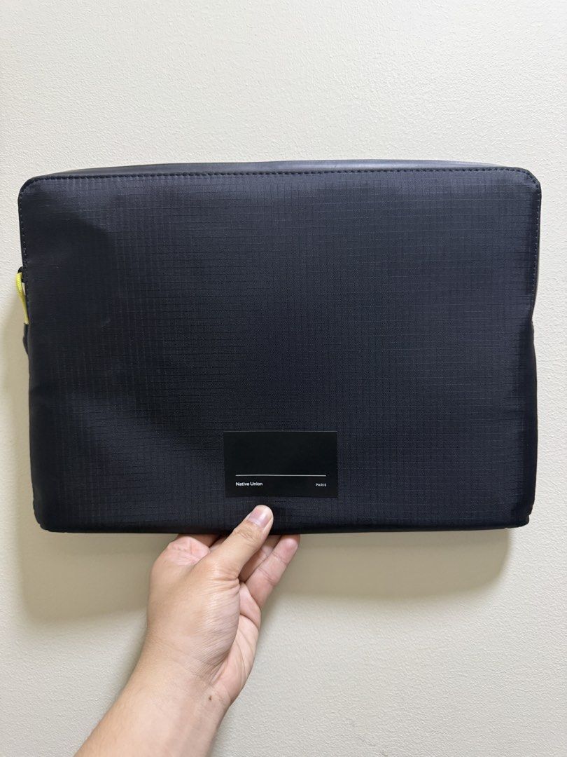 Native Union Ultralight Macbook Sleeve (Category: Laptop Bags & Sleeves) located in Valenzuela. Submitted by _ty_track_ (Listing ID 1437574199, Image 1). Description: - Native Union Macbook 13 inch sleeve - Color: Black - Zippered main compartment - Front pocket for accessories - Durable, water-resistant material - Minimalist design - Bright yellow zipper pull - RFS: got a bigger macbook.