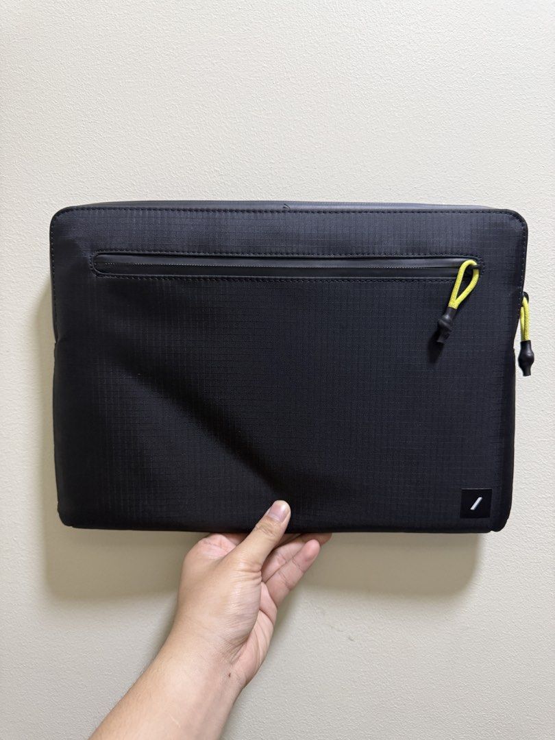 Native Union Ultralight Macbook Sleeve (Category: Laptop Bags & Sleeves) located in Valenzuela. Submitted by _ty_track_ (Listing ID 1437574199, Image 2). Description: - Native Union Macbook 13 inch sleeve - Color: Black - Zippered main compartment - Front pocket for accessories - Durable, water-resistant material - Minimalist design - Bright yellow zipper pull - RFS: got a bigger macbook.