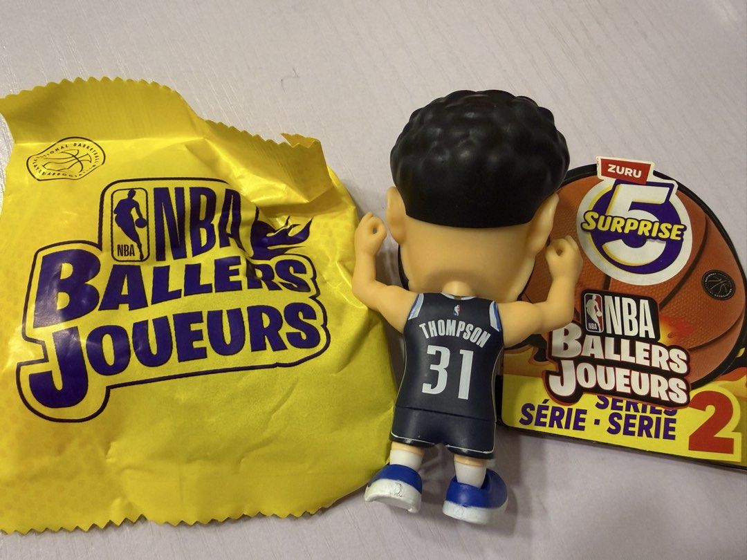 NBA Ballers Series 2 Thompson Figure (Category: Figurines & Statues) located in San Jose del Monte. Submitted by avasmom (Listing ID 1437501581, Image 2). Description: - NBA Ballers Series 2 collectible figure - Features Thompson with jersey number 31 - Comes with original packaging: yellow blind bag and card - Bobblehead design - ZURU product.
