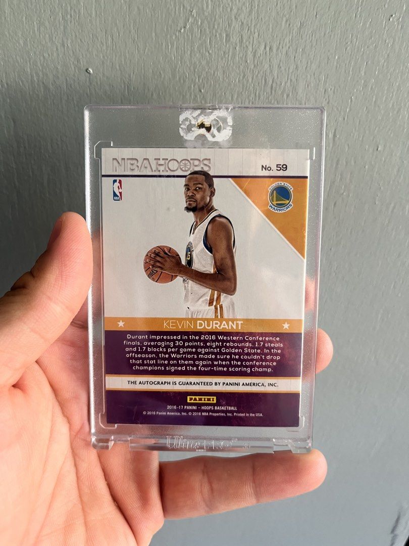 NBA Hoops Kevin Durant Autograph Card (Category: Raw Singles) located in Manila. Submitted by allaboutthemhobbies_ (Listing ID 1437488158, Image 2). Description: - 2016-17 NBA Hoops Trading Card - Features Kevin Durant - "Hot Signatures" Autograph Card - Numbered 59 - Comes with a protective case.