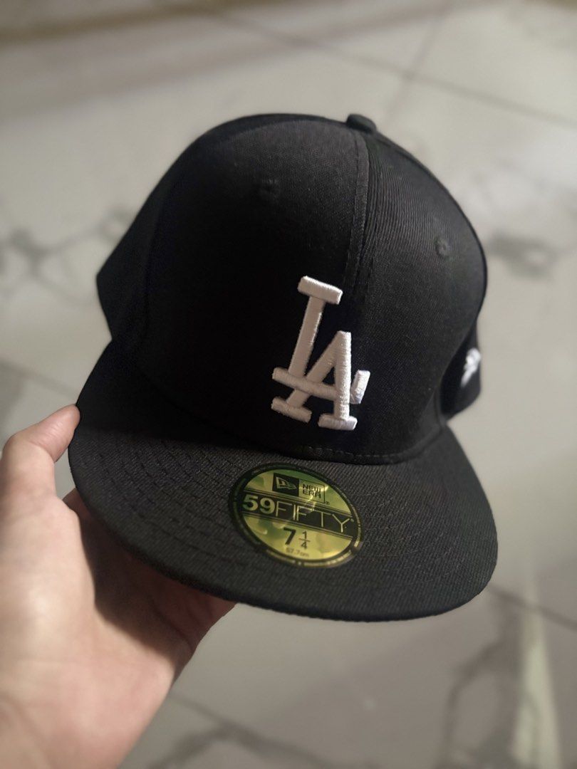 New Era 59FIFTY Los Angeles Dodgers Cap (Category: Caps & Hats) located in Navotas City. Submitted by izzmya (Listing ID 1437468963, Image 1). Description: - New Era 59FIFTY cap - Los Angeles Dodgers logo - Black color - Flat brim - Fitted design - Size: 7 1/4 - MLB logo on the back - New Era logo on the side - Cooperstown Collection.