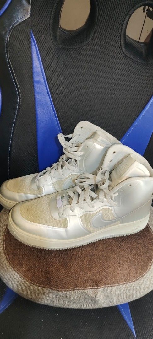 Nike Air Force 1 High Top Sneakers (Category: Sneakers) located in Pulilan. Submitted by cbssurplus (Listing ID 1437505580, Image 1). Description: - Nike Air Force 1 HYPERFUSE high-top sneakers - White and silver colorway - Classic Nike design - Iconic swoosh logo - Size tag visible - SIZE 10 US - MEJO MADUMI LANG, NO ISSUE MINIMAL SIGND IF USAGE ONLY - WE SHIP VIA J&T SF MUST BE PAID BY BUYER - PAYMENT FIRST .