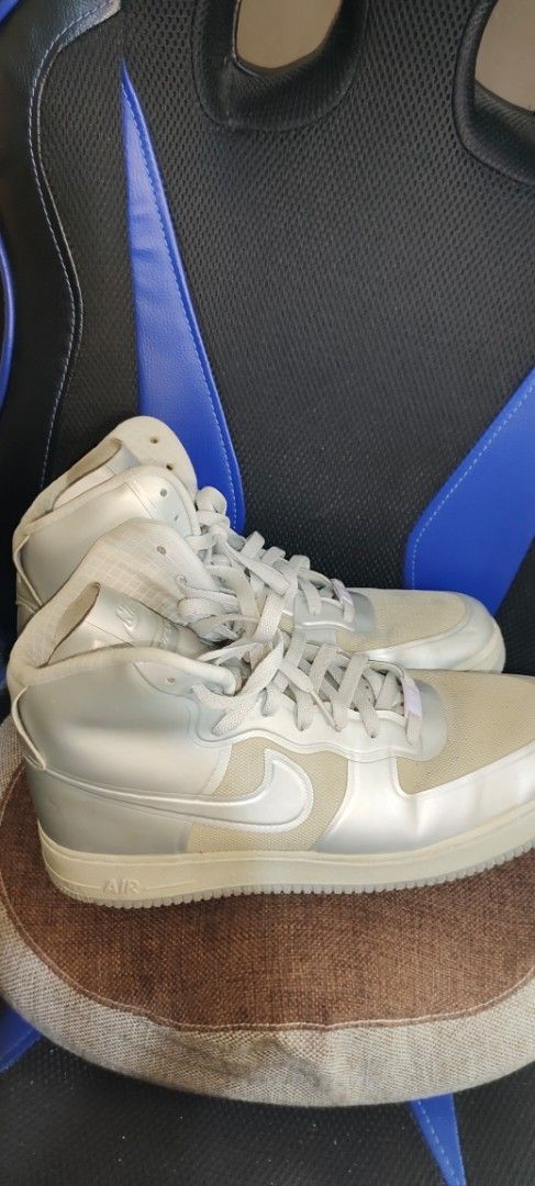 Nike Air Force 1 High Top Sneakers (Category: Sneakers) located in Pulilan. Submitted by cbssurplus (Listing ID 1437505580, Image 2). Description: - Nike Air Force 1 HYPERFUSE high-top sneakers - White and silver colorway - Classic Nike design - Iconic swoosh logo - Size tag visible - SIZE 10 US - MEJO MADUMI LANG, NO ISSUE MINIMAL SIGND IF USAGE ONLY - WE SHIP VIA J&T SF MUST BE PAID BY BUYER - PAYMENT FIRST .