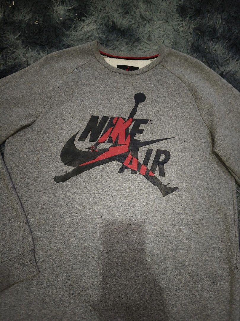 Nike Air Jordan Sweatshirt (Category: Coats, Jackets and Outerwear) located in Manila. Submitted by purefire-477a (Listing ID 1437515677, Image 3). Description: - Gray Nike Air Jordan sweatshirt - Features the iconic Nike Air Jordan logo - Crew neck design - Long sleeves - Brand: Jordan - Measurements: 22W x 29L - Color Condition: 9.9/10.