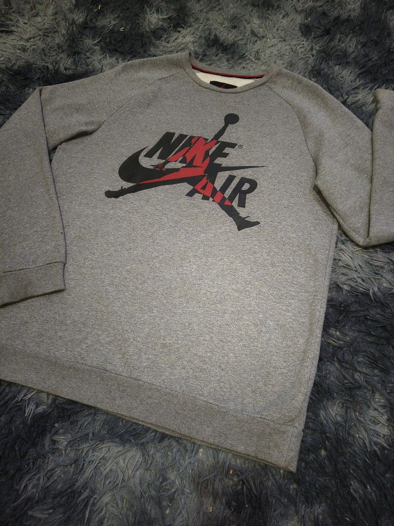 Nike Air Jordan Sweatshirt (Category: Coats, Jackets and Outerwear) located in Manila. Submitted by purefire-477a (Listing ID 1437515677, Image 2). Description: - Gray Nike Air Jordan sweatshirt - Features the iconic Nike Air Jordan logo - Crew neck design - Long sleeves - Brand: Jordan - Measurements: 22W x 29L - Color Condition: 9.9/10.