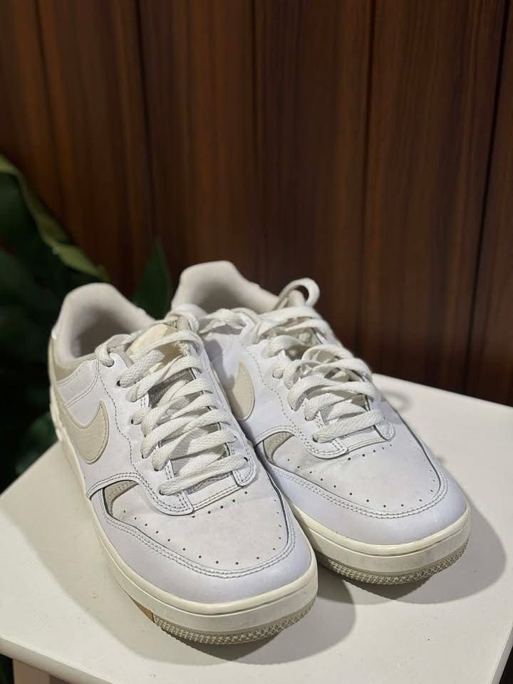 Nike Court Vision Low White (Category: Sneakers) located in Manila. Submitted by mariellmobii (Listing ID 1437535257, Image 2). Description: - White Nike Court Vision Low sneakers - White leather upper - Beige swoosh and accents - White and brown sole - White laces - Padded collar - Low-top design.