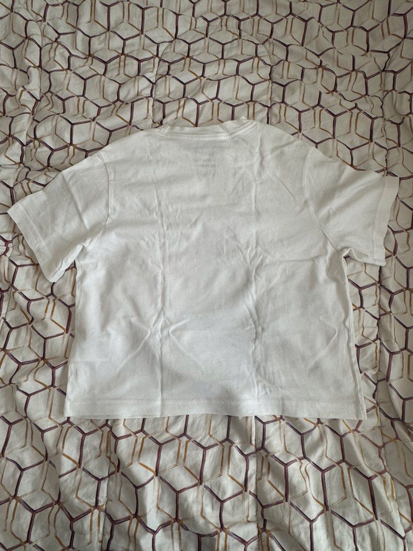Nike Together We Fly T-shirt (Category: Shirts) located in Manila. Submitted by yocindel (Listing ID 1437503231, Image 2). Description: - White Nike t-shirt - Crew neck design - Front: "TOGETHER WE FLY" graphic with Nike logo - Back: Plain white - Perfect for everyday wear - Comfortable and stylish.