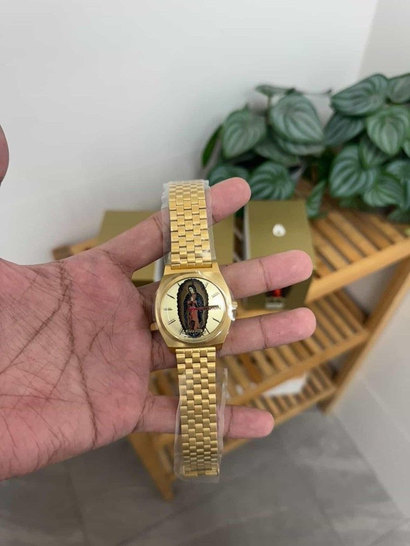 Nixon Watch with Virgin Mary Dial (Category: Men's Watches) located in Caloocan City. Submitted by ankng_mdr (Listing ID 1437531597, Image 2). Description: - Gold-toned Nixon watch - Unique Virgin Mary dial - Gold-toned bracelet and case - Nixon logo on the back - Includes original box.