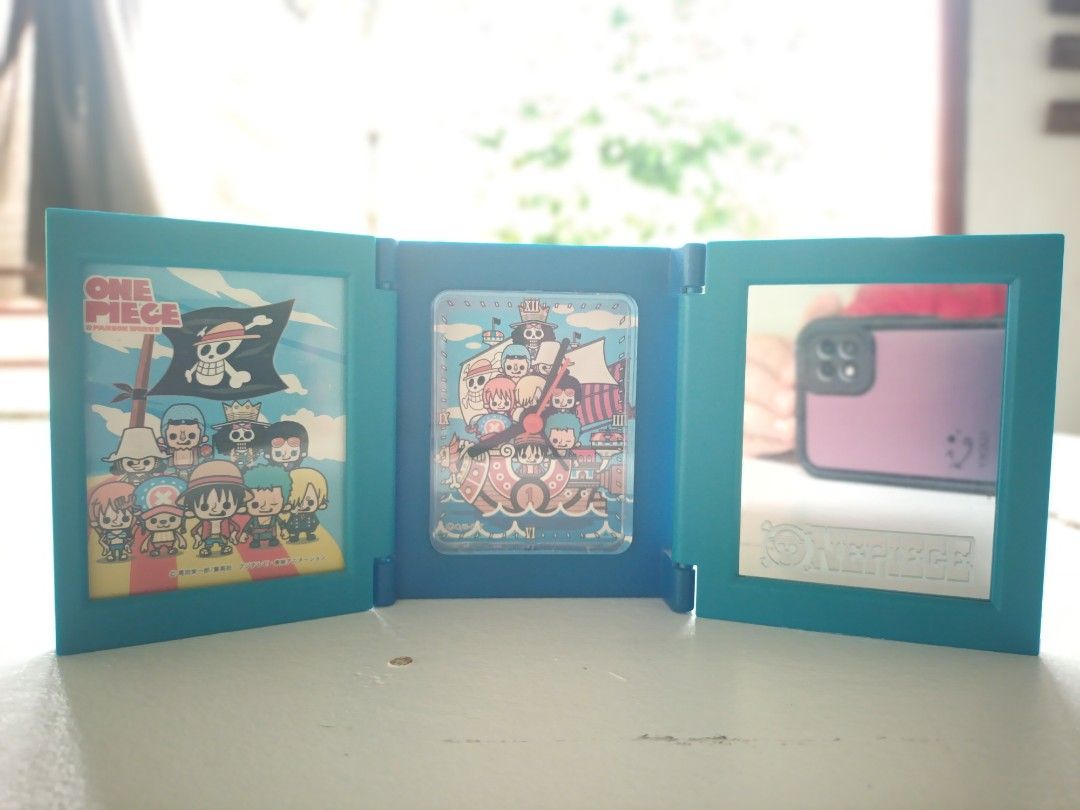 One Piece Desk Alarm Clock (Category: Clocks) located in Tacurong. Submitted by truestar_eae6a4 (Listing ID 1437473576, Image 2). Description: It's an adorable One Piece merch that you can add to your anime collection! ✨️ Aside from a working alarm clock, it also features a small mirror and a small picture frame, when opened..