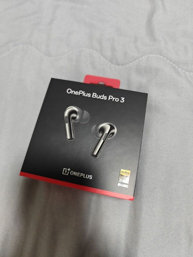 OnePlus Buds Pro 3 (Category: Earphones) located in Quezon City. Submitted by geminimomma2 (Listing ID 1437481024, Image 1). Description: - Brand new, sealed OnePlus Buds Pro 3. - Features -Res Audio Wireless. - Official OnePlus product. - Sleek black box with a red accent. - Box art showcases silver earbuds..