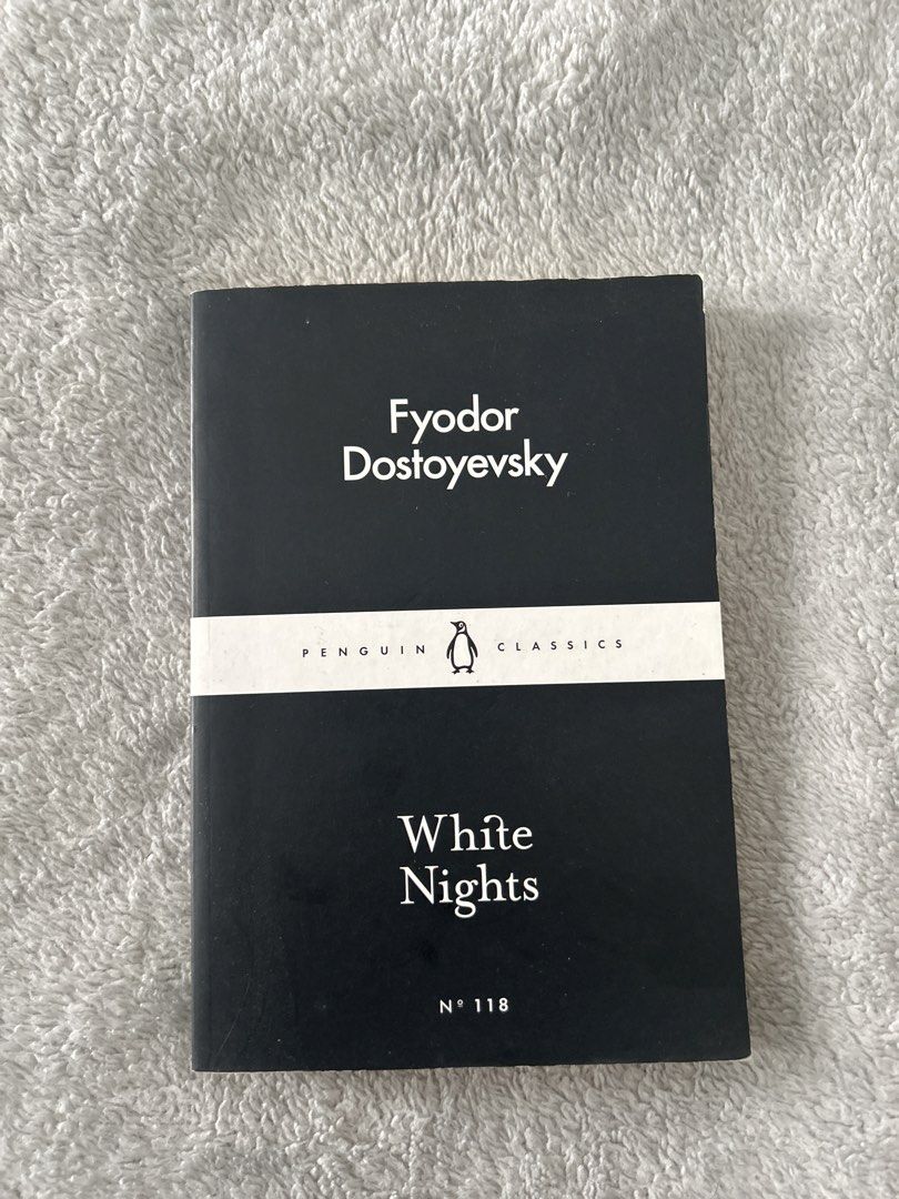 Penguin Classics White Nights by Fyodor Dostoevsky (Category: Storybooks) located in Manila. Submitted by buyme4sale (Listing ID 1437436369, Image 1). Description: - White Nights by Fyodor Dostoevsky - Published by Penguin Classics - Features a black cover with white lettering - Includes a white band with the Penguin logo - Book number 118 in the Penguin Classics series.