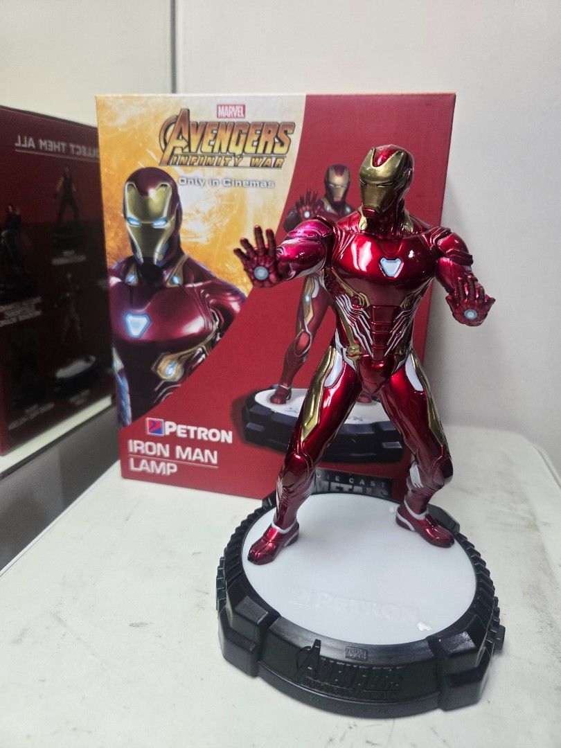 Petron Iron Man Lamp - Avengers Infinity War (Category: Western Merchandise) located in San Juan City. Submitted by cjhwan (Listing ID 1437532897, Image 1). Description: Petron Iron Man lamp featuring the Avengers Infinity War design. The lamp has a figure of Iron Man in a dynamic pose. It comes with a base that has a white surface. The box is included. A great collectible item for Marvel fans. Lamp has usb cable and working. .
