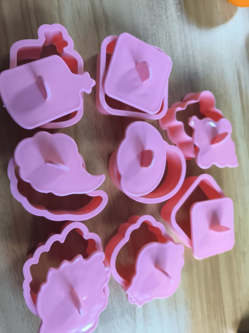 Pink Cookie Cutters Set (Category: Bakeware) located in Cavite. Submitted by Combiishop (Listing ID 1437423336, Image 1). Description: - Set of pink cookie cutters. - Includes flower, square, and decorative shapes. - Ideal for cookies and other treats. - Perfect for baking enthusiasts. - Suitable for beginners and experienced bakers..