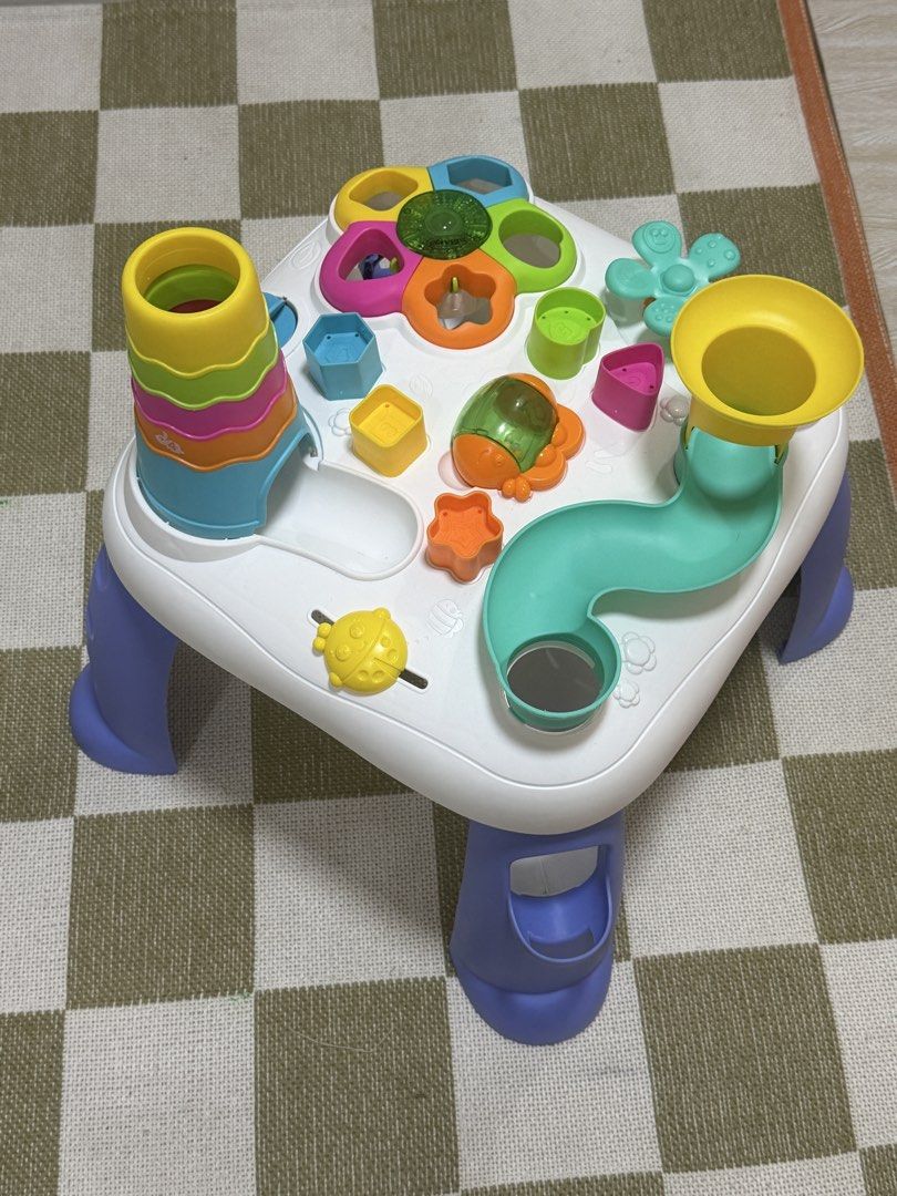 Playgro sensory Table for Babies and Toddlers (Category: Infant Playtime) located in Manila. Submitted by shopelisse (Listing ID 1437508894, Image 1). Description: - Colorful activity table for toddlers. - Includes stacking tower, ball run, and shape sorters. - White surface with colorful toys and blue legs. - Designed to stimulate sensory development. - Encourages fine motor skills. - Perfect for toddlers. Bought for 3500.