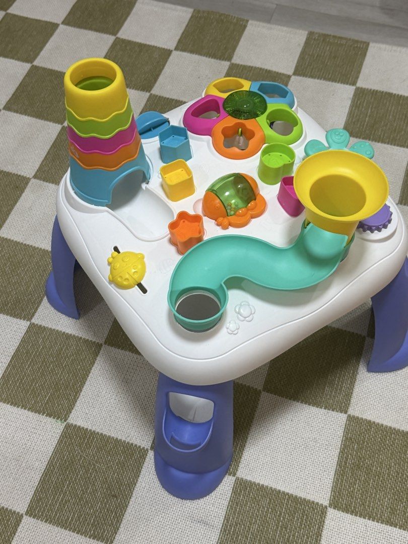 Playgro sensory Table for Babies and Toddlers (Category: Infant Playtime) located in Manila. Submitted by shopelisse (Listing ID 1437508894, Image 3). Description: - Colorful activity table for toddlers. - Includes stacking tower, ball run, and shape sorters. - White surface with colorful toys and blue legs. - Designed to stimulate sensory development. - Encourages fine motor skills. - Perfect for toddlers. Bought for 3500.