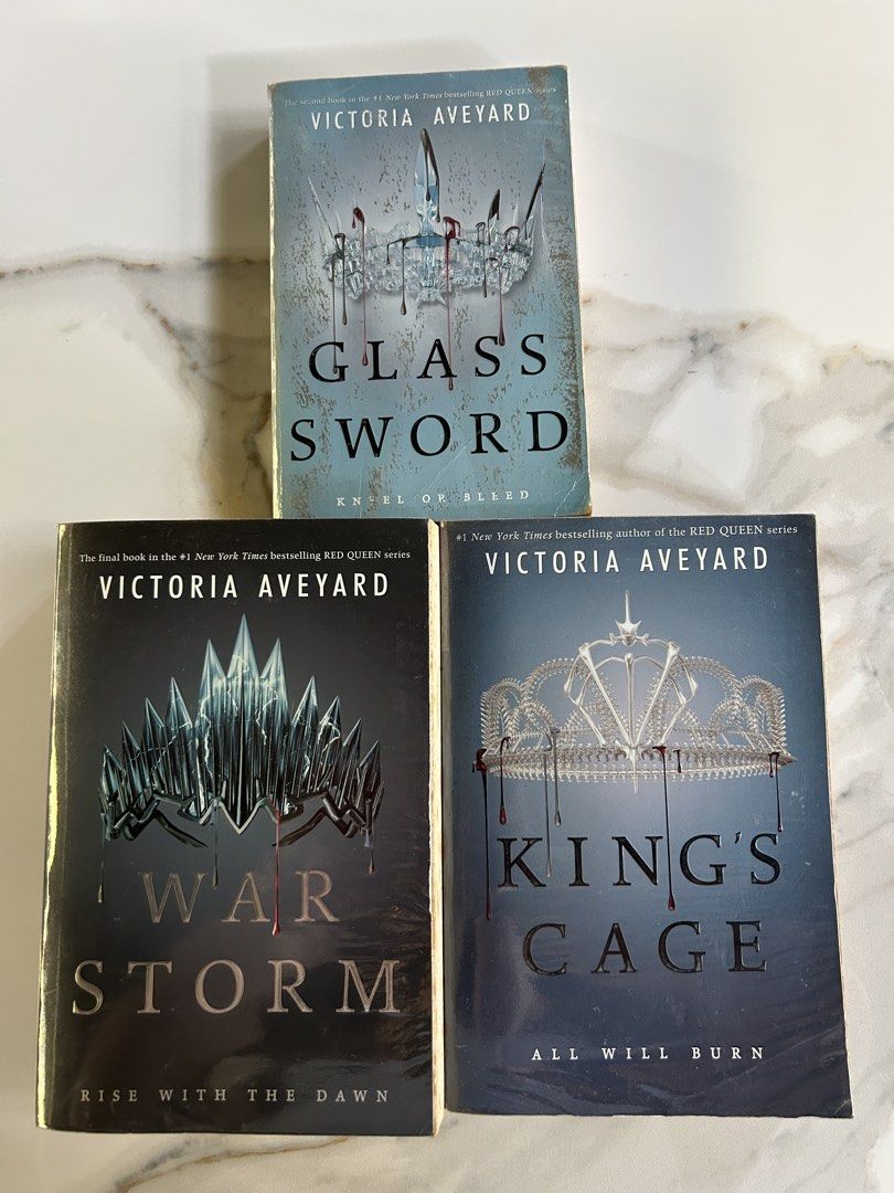 PRELOVED BOOKS - Red Queen series (Category: Storybooks) located in Dasmarinas. Submitted by vminniescart (Listing ID 1437448155, Image 1). Description: Glass Sword, Kings Cage & War Storm: ₱980 set - has foxing at the top & bottom part - has plastic cover 💵 BDO/ Gotyme/ Union Bank 📍 Dasmariñas City, Cavite.