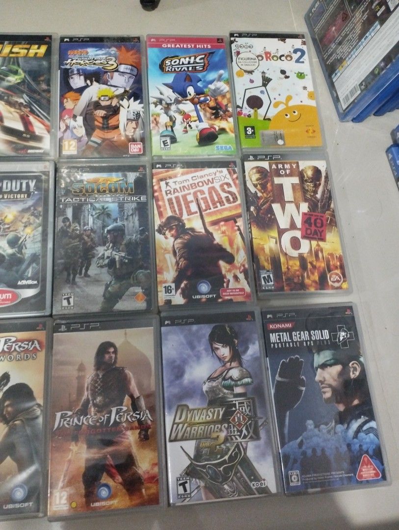 PSP Games - Various Titles (Category: PlayStation) located in Cavite. Submitted by gamebear27 (Listing ID 1437478426, Image 3). Description: 51 psp games in case 28 PSP with no case. 6 PSP Not in the pictures. Twisted metal Naruto 2 Ace combat x Harry Potter and the goblet of fire. Pink working need LCD replacement no battery and no battery cover. Blue not working White working eject button broken no battery cover. Black working no battery cover 