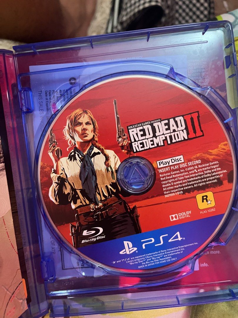 Red Dead Redemption 2 - PS4 (Category: PlayStation) located in Manila. Submitted by loscar_1412 (Listing ID 1437431008, Image 2). Description: - Red Dead Redemption 2 for PlayStation 4 - Includes game disc and case - Western-themed open-world gameplay - Published by Rockstar Games - Rated M for Mature.