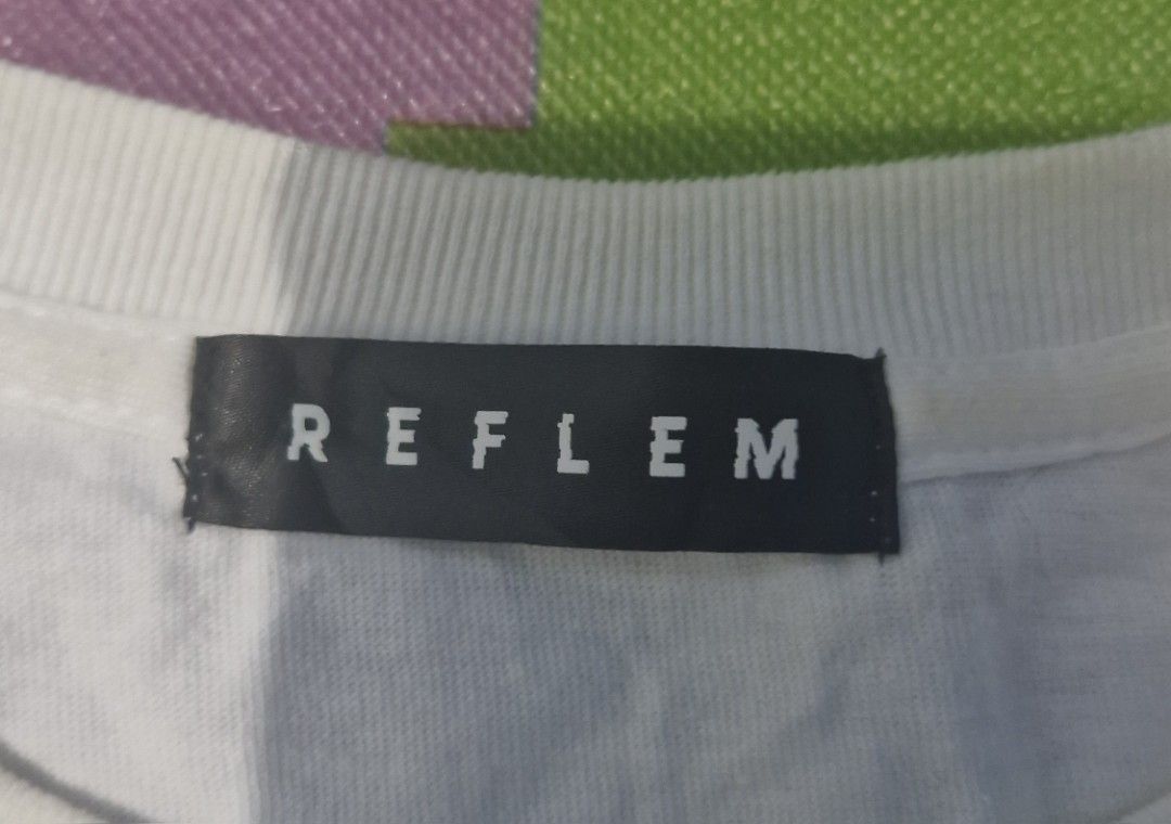 Reflem Long Sleeve Graphic Tee (Category: Tshirts & Polo Shirts ) located in Pili. Submitted by the_g_thrift (Listing ID 1437541105, Image 3). Description: - Reflem long sleeve tee - Unique graphic design - White base with black graphics - Detachable sleeves with tribal patterns - Crew neck - Free size -dimes : 23 x 31 need wash only.