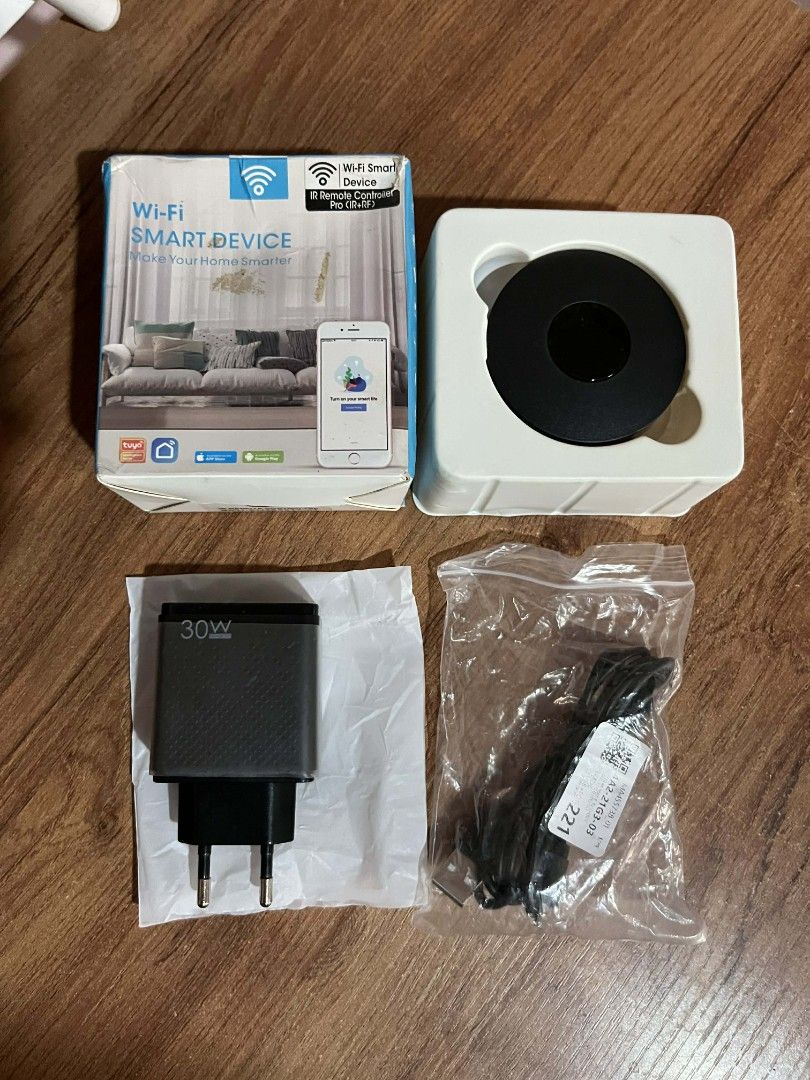 SALE! Wi-Fi Smart Device (Category: Networking) located in Gapan. Submitted by lunashop14 (Listing ID 1437428998, Image 1). Description: - Smart Wi-Fi device for home control - Includes a 30W charger - Comes with a cable - Brand new, in original packaging - Controls home appliances remotely - Features a smartphone interface (as shown on the box).