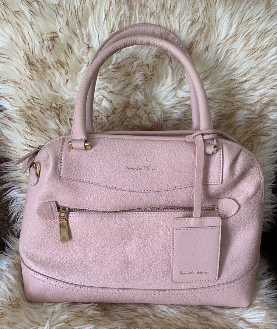 Samantha Thavasa Pink Shoulder Handbag (Category: Luxury Bags & Wallets) located in Cavite. Submitted by mommydaddybabyshop (Listing ID 1394290185, Image 1). Description: 🇯🇵 Preloved Authentic Samantha Thavasa- Japan ✅ Intact Leather ✅Clean interior/ gold hardware ✅Has a large space/ capacity to hold stuff Condition: Has scratches in front, at the back and small rubbings in 4 corners Nego price, Pm is the key ❤️ ❌Strictly NO COD Mop: gcash/bank