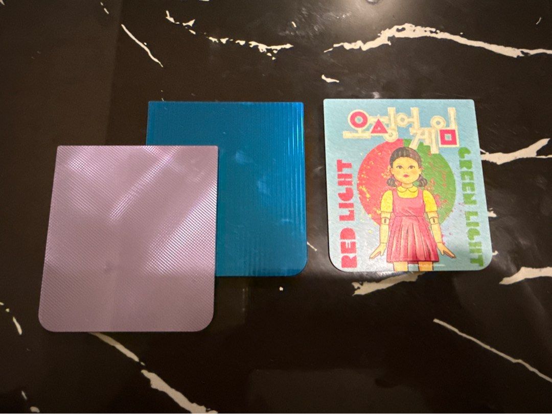Samsung flipsuit card - squidgame + 2 plain (Category: Other Accessories) located in Quezon City. Submitted by joroguhi (Listing ID 1437510951, Image 1). Description: selling as a SET - squidgame tested only before and works po (sa z flip 5 ko na test). Cannot test now, wala na akong z flip - 2 plain na pang decorate/cover lang din 📍qc sdd, j&t gcash, gotyme .