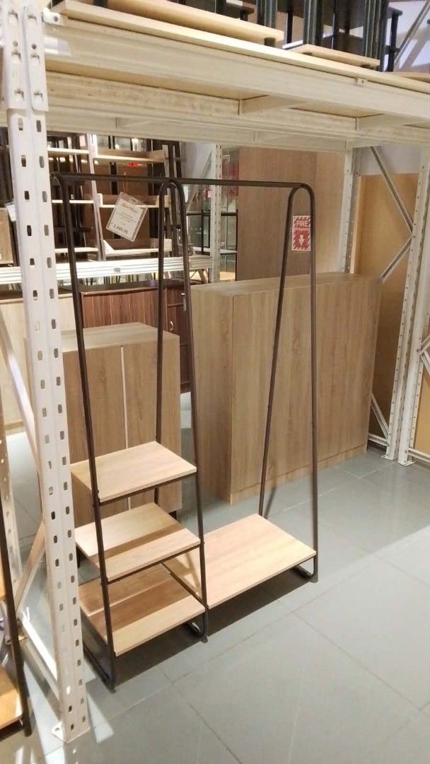San Yang Open Wardrobe - Clothe Rack (Category: Shelves, Cabinets & Racks) located in Pasig City. Submitted by urai_ (Listing ID 1437458449, Image 1). Description: - Stylish open wardrobe - Minimalist design - Color: White oak and brown - Features: - Hanging rod - Multiple shelves - Materials: Melamine, particle board, and powder-coated metal - Dimensions: 110 x 40 x 170 cm (LWH) - Perfect for organizing clothes and accessories..