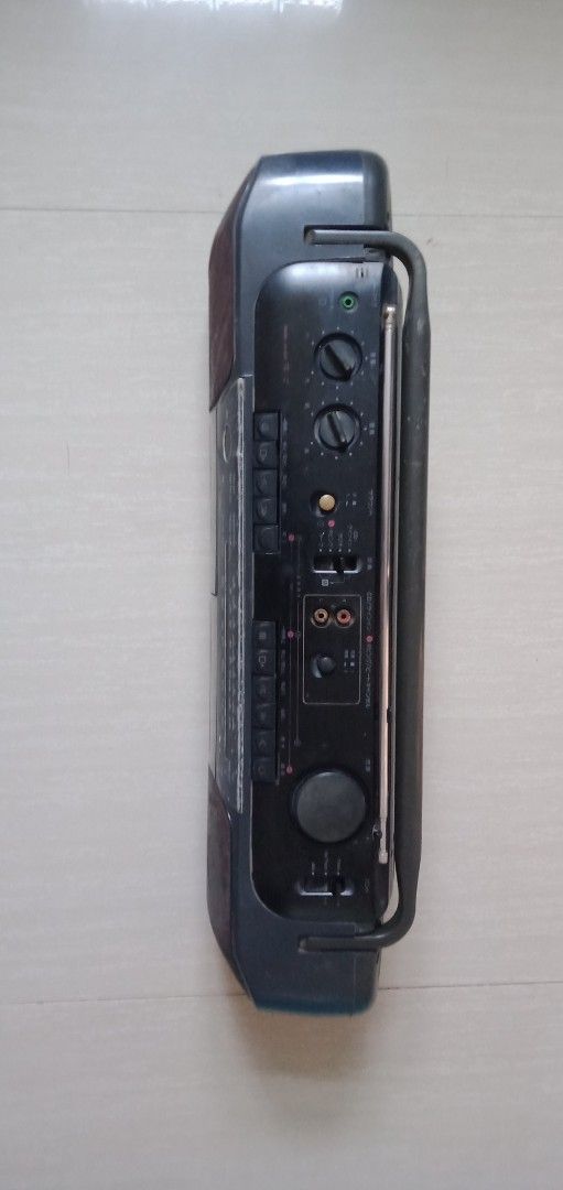 Sanyo Boombox (Category: Portable Music Players) located in Bulacan. Submitted by dyazpuzhpley021577r (Listing ID 1437440458, Image 2). Description: - Vintage Sanyo boombox - Dual cassette decks (A & B) - Built-in radio - Portable with a handle - Includes power cord - Built-in antenna - Features control knobs and buttons - Dark color scheme working unit fm tape issue need to use headphone or earphone para magamit di po lumabas sound sa main speak
